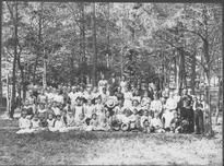 SA0208 - Identified as "The Picnic May 1887" on reverse. A large group of Shakers in a grove.
